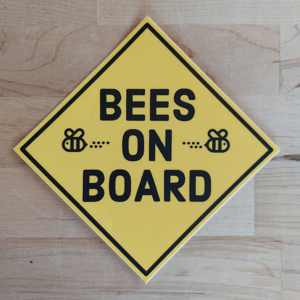 Yellow background with black text reading BEES ON BOARD sticker