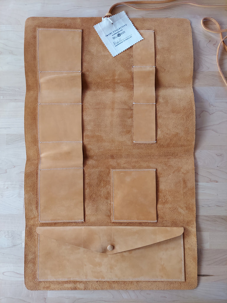 Leather tool roll made to store beekeeping tools.