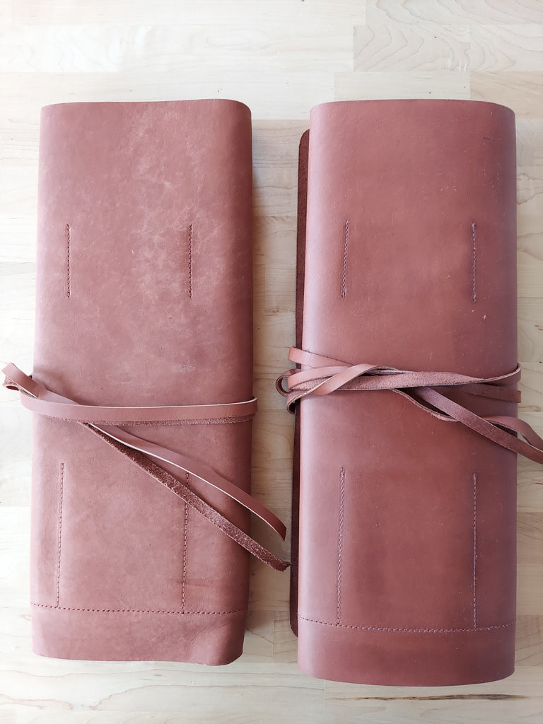 Leather tool roll made to store beekeeping tools.