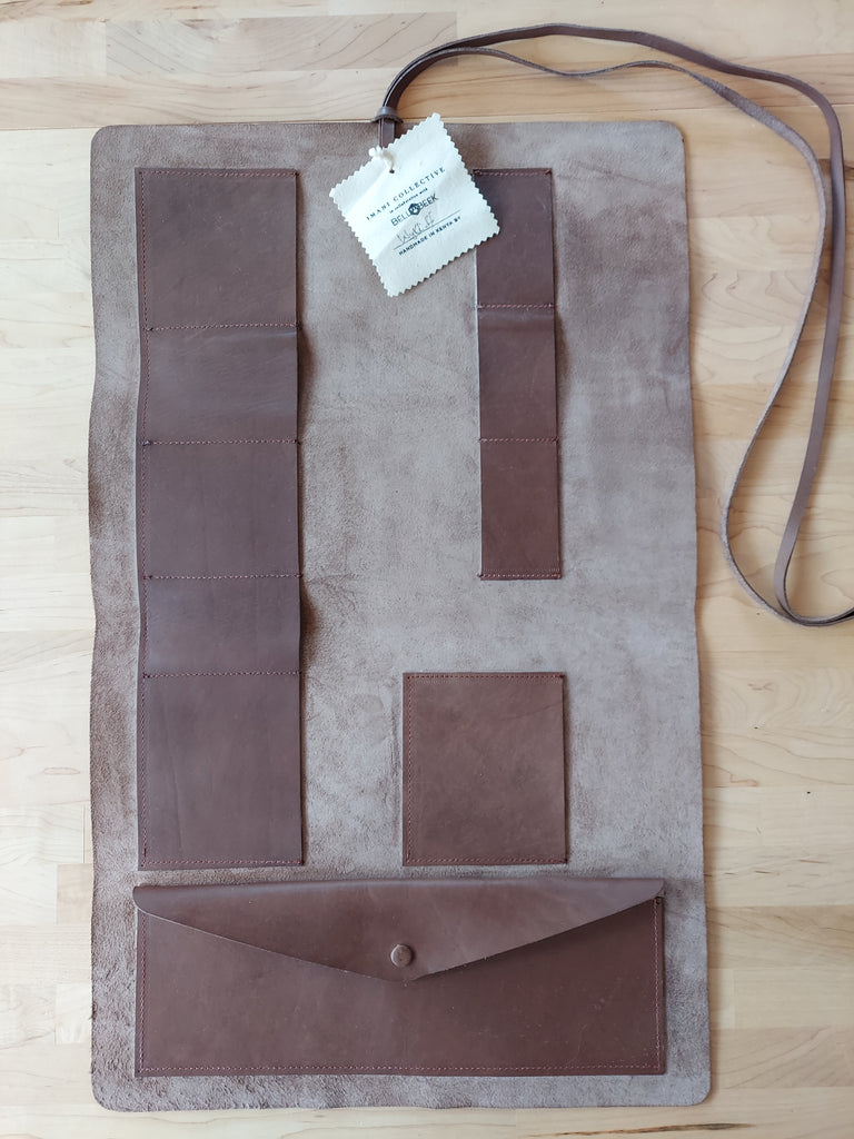 Leather tool roll made to store beekeeping tools.