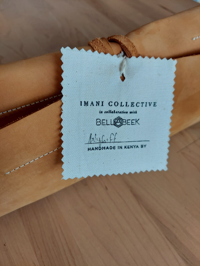 Leather tool roll made to store beekeeping tools.