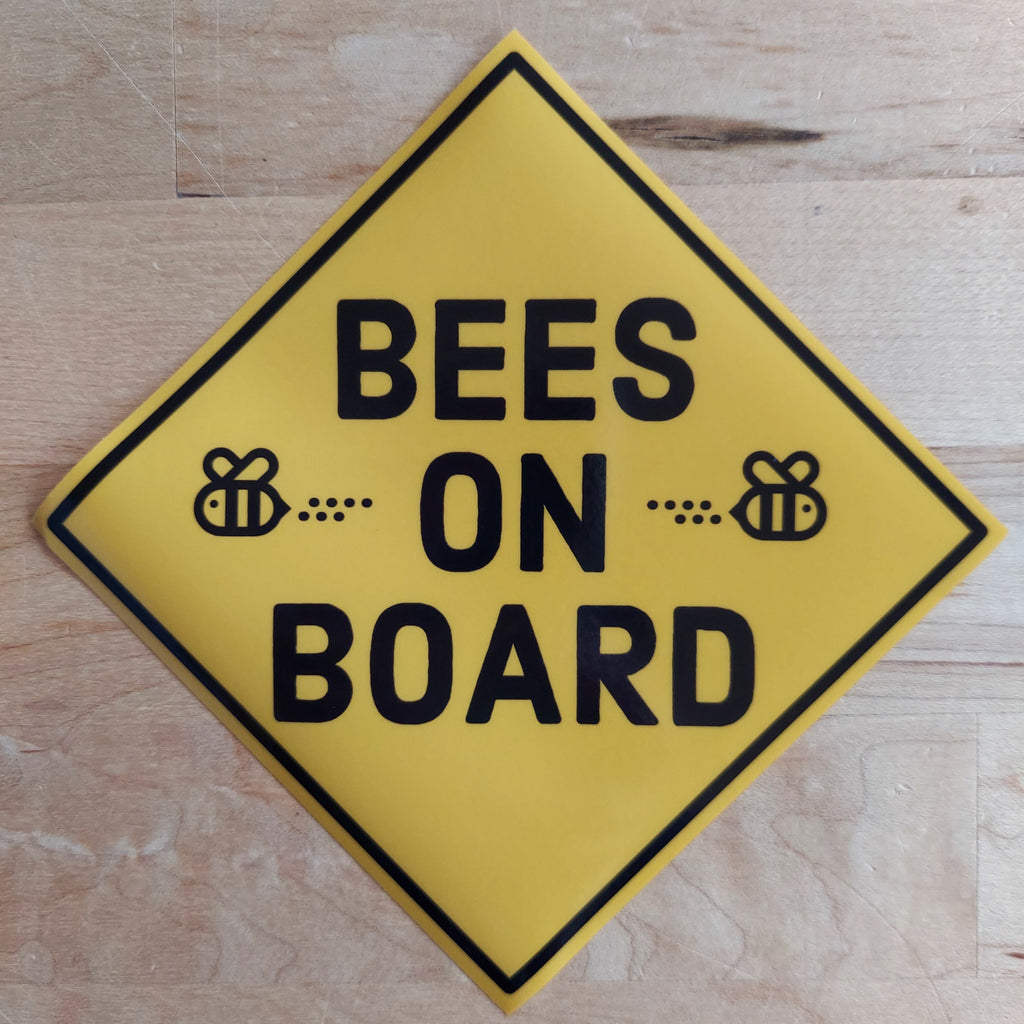 Bees On Board. Yellow sideways square with black text and 2 black outlined bees.