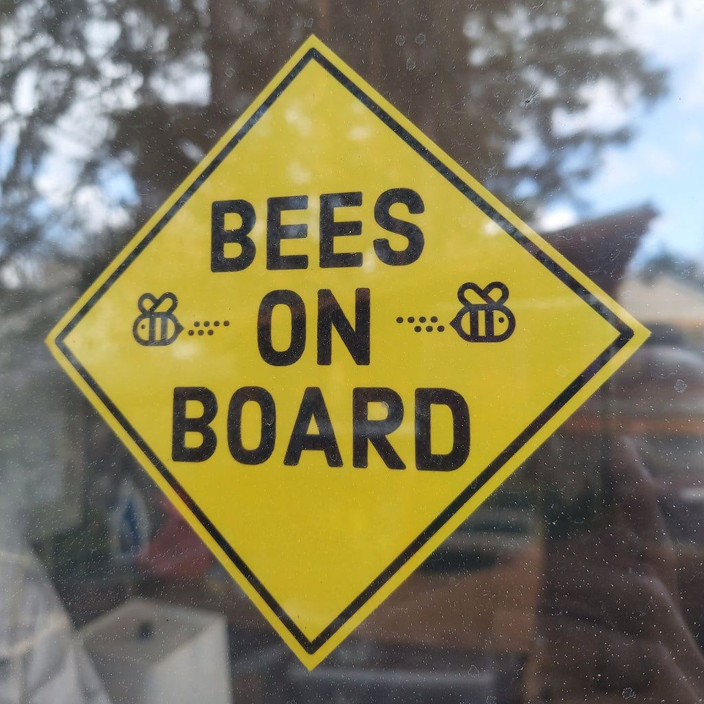 Bees On Board. Yellow sideways square with black text and 2 black outlined bees.